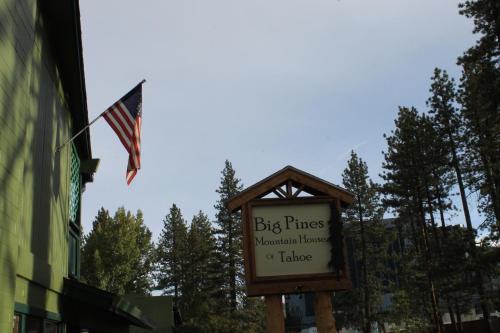 a sign for the big phrases mountain house village with an american flag at Big Pines Mountain House in South Lake Tahoe
