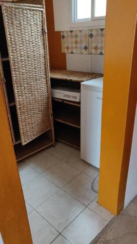a kitchen with a laundry room with a washer and dryer at palm nature lodge in Sanyang