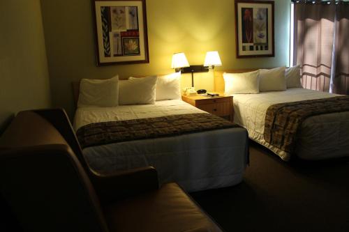 a hotel room with two beds and a window at Big Pines Mountain House in South Lake Tahoe