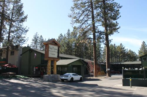 a small white car parked in front of a building at Big Pines Mountain House in South Lake Tahoe