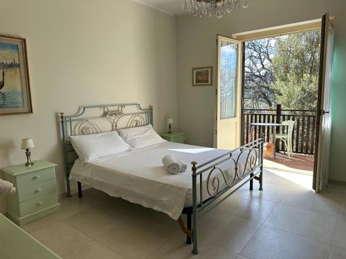 a bedroom with a bed and a large window at B&B Bee in Frascati
