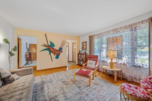 a living room with a couch and a table at Castle View - Wifi, Pet Friendly, Screen Porch, Game Room, Grill, Family Friendly, Kid Friendly, Fireplace in Berkeley Springs