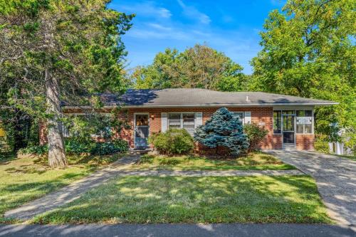 a brick house with a driveway at Castle View - Wifi, Pet Friendly, Screen Porch, Game Room, Grill, Family Friendly, Kid Friendly, Fireplace in Berkeley Springs