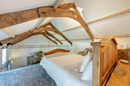 a bedroom with a large bed and wooden beams at 2 Bed in Kelly oc-k29333 in Kelly