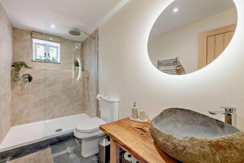 a bathroom with a large stone sink and a tub at 2 Bed in Kelly oc-k29333 in Kelly