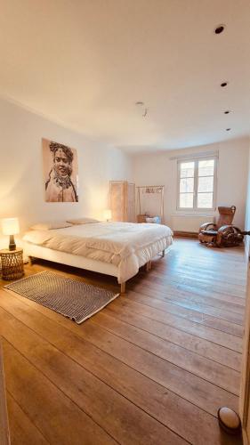 a bedroom with a large bed in a room at Alcazar in Mechelen