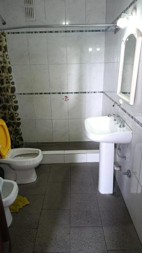 a bathroom with a sink and a toilet at hotel tango club in Buenos Aires