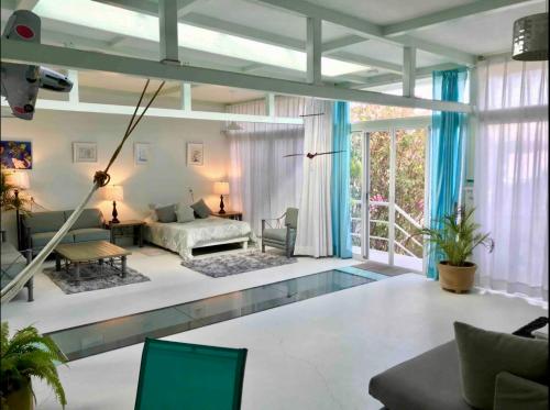 a living room with a swimming pool in the middle of it at 2nd floor loft with swimming pool in Oaxaca City
