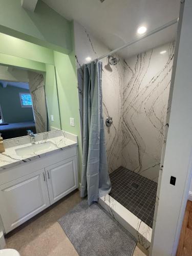 a bathroom with a shower and a sink at Santa Cruz Hostel in Santa Cruz