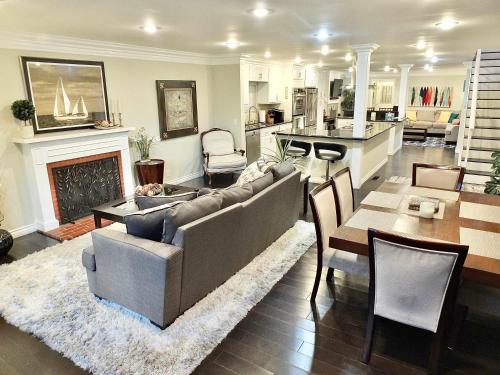 a living room with a couch and a fireplace at LB Peninsula Steps to Beach close to in Long Beach