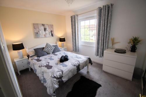 a bedroom with a bed and a window at Inverness Holiday Retreat - 2 Bedroom in Inverness
