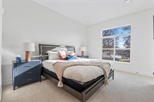 a bedroom with a large bed and a window at Serengeti Suite in Downtown Eagle in Eagle