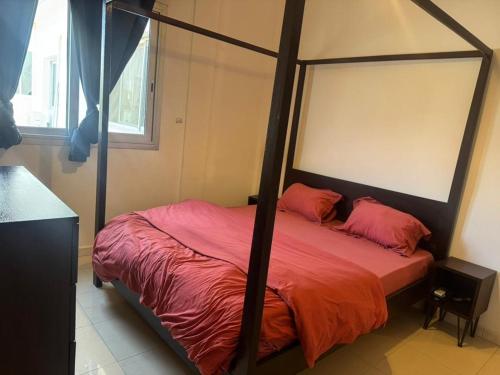 Llit o llits en una habitació de Keur Thierno