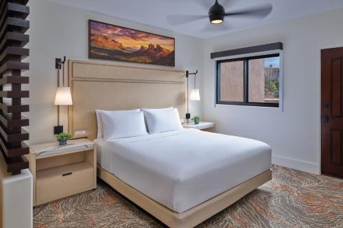 a bedroom with a large white bed and a window at Hyatt Vacation Club at Pinon Pointe, Sedona in Sedona