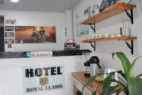 a coffee shop with aokedokedokedokedokedokedoked at Hotel Royal Classy in Villavicencio