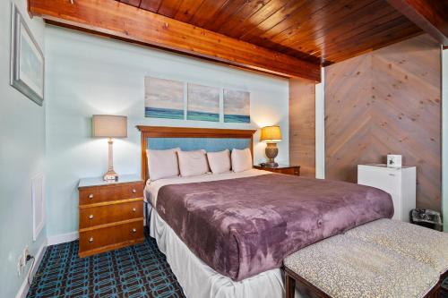 a bedroom with a large bed in a room at Oceanfront Inn Room #9 in Fort Pierce