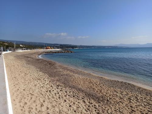 a beach with a few people and the ocean at Tableau de La Ciotat - Host Provence in La Ciotat