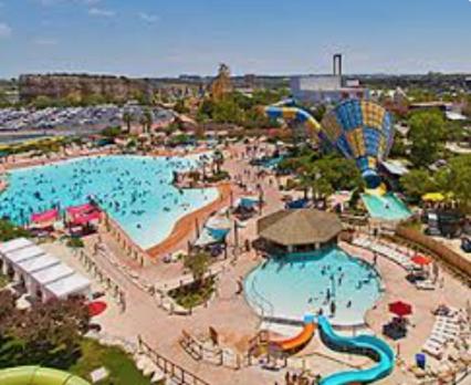 an aerial view of a water park with a pool at 4 Bed sleeps 12 -Sea world-Six Flags-Down Town - Emerald Oasis in San Antonio