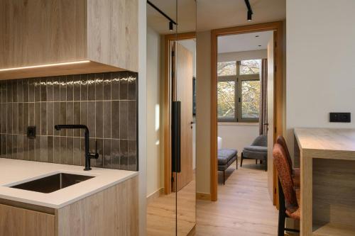 a kitchen with a sink and a counter at Residence Inn Lisbon by Marriott Hotel in Lisbon
