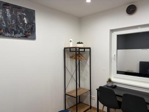 a room with a table and a desk with a window at Urban Stay & Style in Parsberg