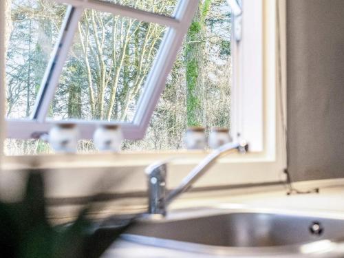 a sink in a kitchen with a window at Tranquil Retreat in Skaerbaek in Skærbæk