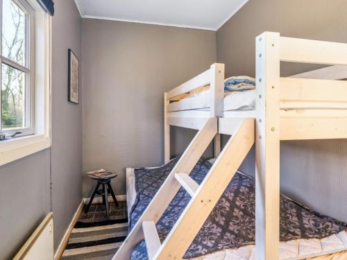 a bunk bed room with two bunk beds at Tranquil Retreat in Skaerbaek in Skærbæk