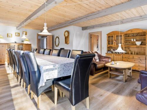 a dining room with a table and chairs at 5 star holiday home in Gram in Gram