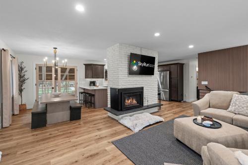 a living room with a fireplace and a couch at The Covington Haus in Minnetonka