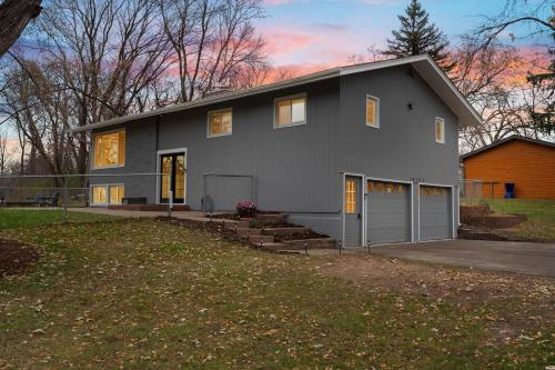 a gray house with a garage at The Covington Haus in Minnetonka