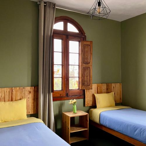 Econunay Hostels tesisinde bir odada yatak veya yataklar