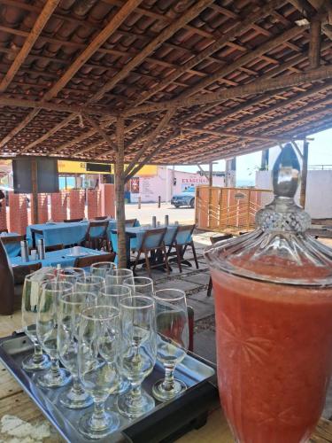 a group of wine glasses sitting on a table at ElRancho Suites in Itaparica