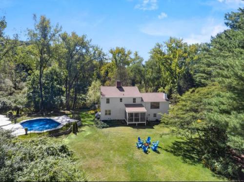 an aerial view of a white house with a pool at Renovated Retreat with Heated Pool in Redding