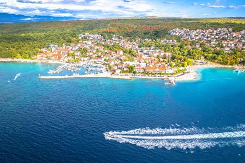 an aerial view of a beach with boats in the water at Apartment Malinska 44 in Malinska