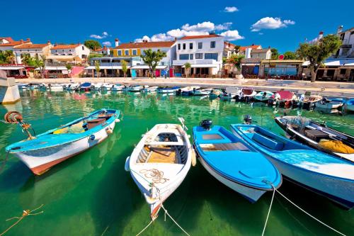 a group of boats in the water in a harbor at Apartment Malinska 44 in Malinska