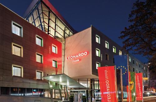 a building with a sign on the side of it at Leonardo Hotel Esslingen in Esslingen