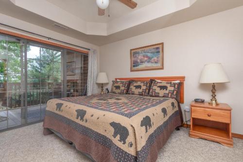 a bedroom with a bed and a window at 1BR Village At Indian Point 601 near SDC-Free Tickets Daily up to $500 in Branson