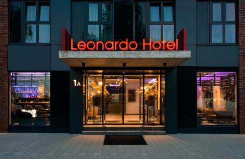 a store front with a sign for a hotel at Leonardo Hotel Hamburg Altona in Hamburg