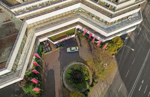 an overhead view of a parking lot in a city at Leonardo Royal Hotel Frankfurt in Frankfurt