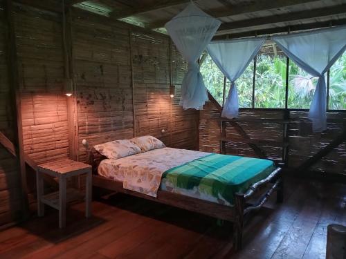 Llit o llits en una habitació de Cabañas Awana