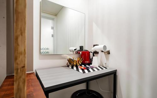 a table with a mirror on top of it at Songdo The Seoleim Hotel Stay in Incheon