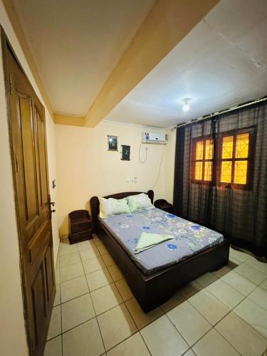 COSY House tesisinde bir odada yatak veya yataklar