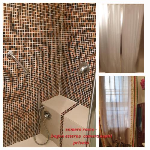 a bathroom with a toilet and a tiled wall at Monteceneri 9 B&b in Rho