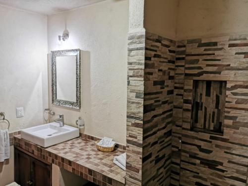 a bathroom with a sink and a mirror at Suite vista hermosa in San Miguel de Allende