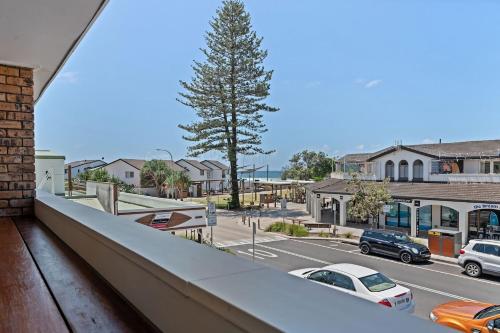 a view of a city street with cars on the road at Sun Soaked in Lennox Head