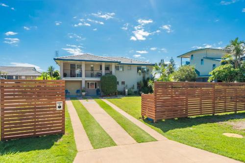 a fence in front of a house at Beach Views in Lennox Head