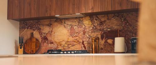 a map on the wall of a kitchen at Blue Ash Studio in Lennox Head