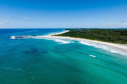 an aerial view of a beach and the ocean at Haere Mai 2 in East Ballina