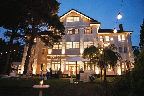 a large building with lights in front of it at The Robertson Hotel in Robertson