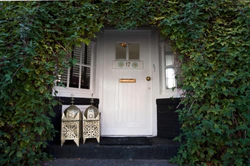 a doorway leading to a small room with a door leading to a garden at Design B&B Naarden Vesting in Naarden
