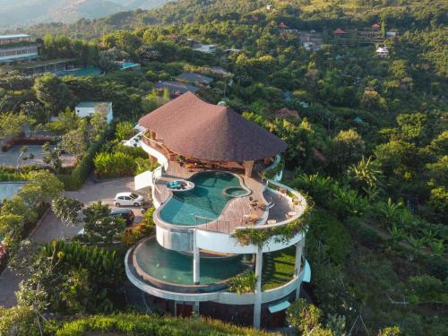 an aerial view of a building with a roof at Sumberkima Resort in Pemuteran
